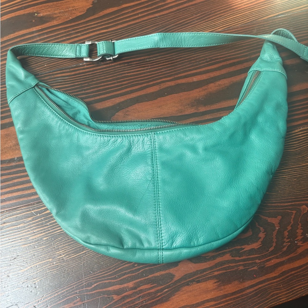 Free People teal (called “forest”) leather Idle Hands sling hobo bag